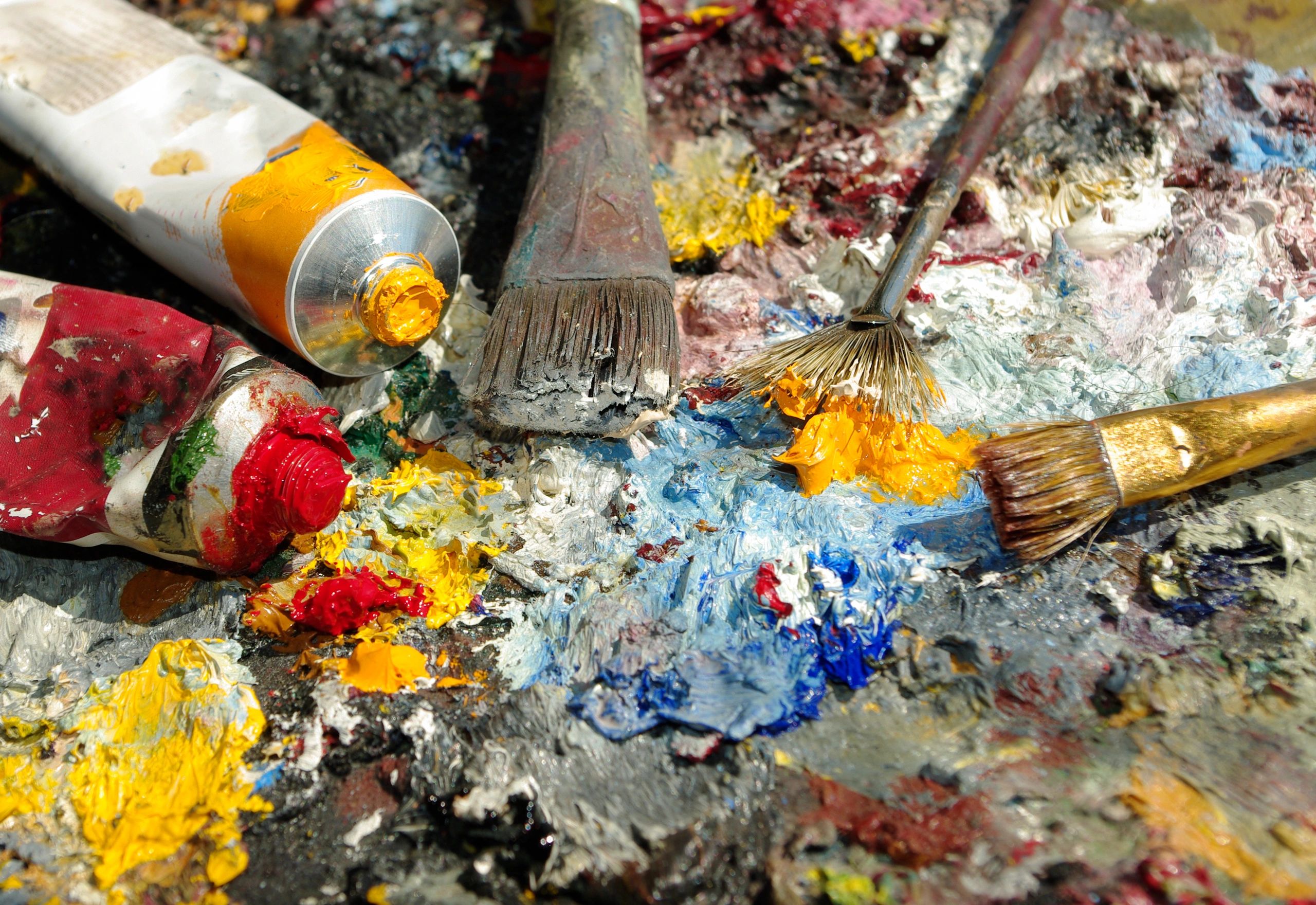 Artist palette and brushes in a studio