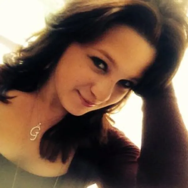 Warm portrait of a woman leaning toward the camera
