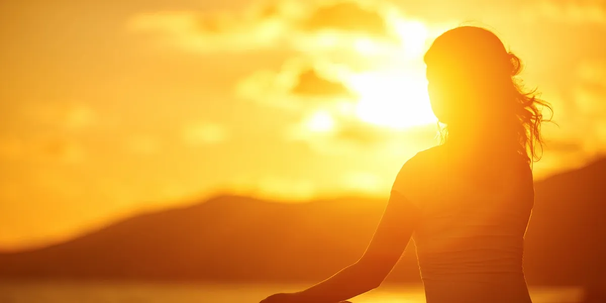 Silhouette seated at sunset for Motivated-Mindset
